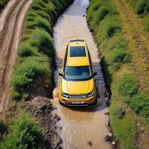 A yellow Land Rover Freelander 4 wheel car is traveling on an off-road route. There is a stream blocking the car's running path.,dodge ram rumble bee,jeep compass,land rover discovery,yellow jeep,jeep