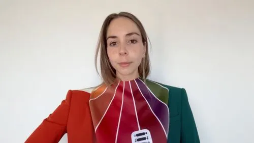 respect the pantone colors and fitted suit with white flat background,a young lady is displaying her neck designs,yelle,clothes hangers,tie,campanella,saleslady,solexa