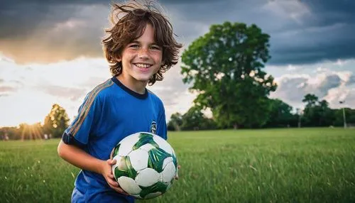 Shota boy, Robert Brownie Jr, 10yo, big smile, bright blue eyes, messy brown hair, freckles on nose, white shirt with rolled up sleeves, dark blue shorts, holding a soccer ball, standing in a green gr