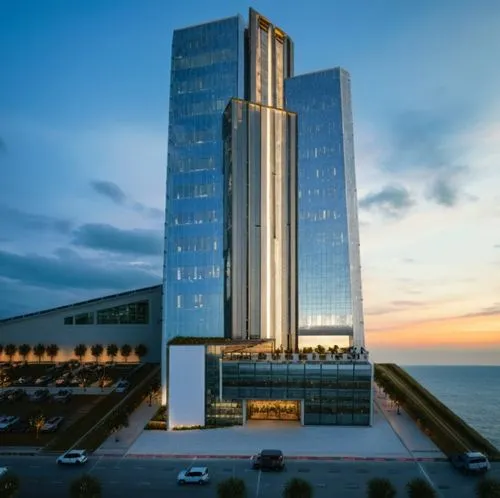 a tall building sitting next to the ocean,gdynia,luanda,maputo,batumi,rotana,umhlanga,Photography,General,Cinematic