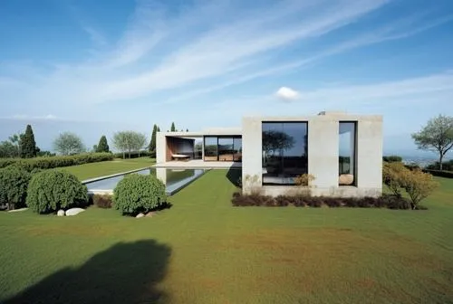 Respetar la imagen,a house on a green grassy field with trees in the foreground,lalanne,modern house,dunes house,tugendhat,siza,simes,Photography,General,Realistic