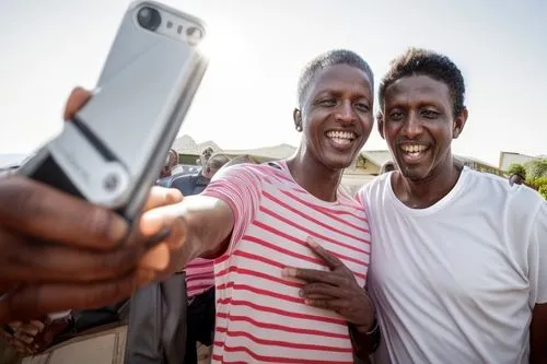 selfie with president ruto ,selfie stick,mobile camera,mobile phones,the integration of social,khartoum,people of uganda,sudan,video call,monopod,taking picture,afar tribe,family taking photos togethe