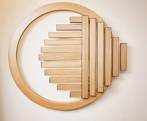 a wall decor made of wood and metal against a white background,a circle made out of wooden strips and sticks,wooden rings,chakram,circular puzzle,circle shape frame,circular ring,clothespins,Conceptua