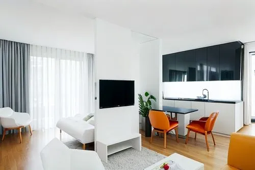 bright modern interior, middle wall with TV. the kitchen to the right and a lighted window with curtains behind the TV wall, white ceiling,modern room,modern decor,shared apartment,contemporary decor,