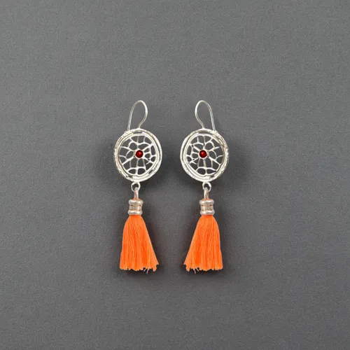 two earrings lie on a white background, top view of the earrings,teardrop beads,jewelry florets,earrings,enamelled,christmas tassel bunting,earring,martisor,watercolor tassels,traffic cones,jewelry ma