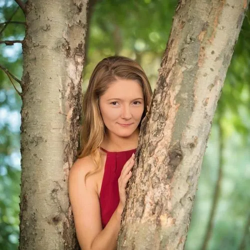 trees,a young woman poses with her arms hanging out from the trunk of a tree,the girl next to the tree,girl in red dress,chipko,birch tree background,senior photos,lopatkina,forest background,girl wit