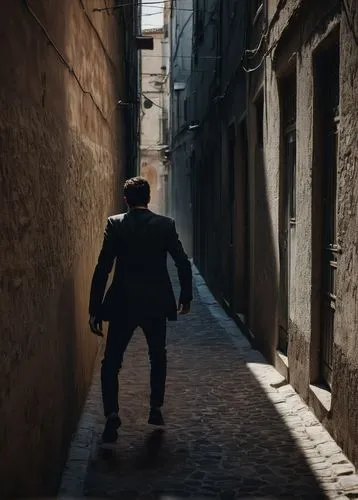 a man chased by his own shadow in an alley,clemenza,valletta,perugia,borsalino,montalbano,siracusa,man silhouette,napoli,passage,silhouette of man,shearim,alley,passero,dicorcia,palermo,marseille,modi