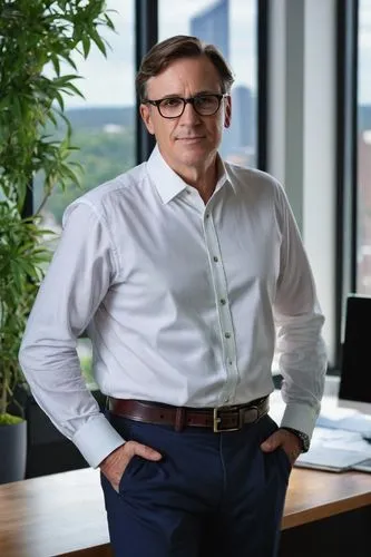 Middle-aged, male, architectural designer, Wilton CT, David, bespectacled, short brown hair, slight stubble, white dress shirt, dark blue trousers, black leather belt, black loafers, standing, hands b