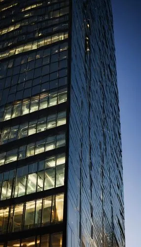 Modern skyscraper, HNTB Architecture Inc., glass and steel structure, sleek lines, angular shape, silver reflective windows, minimalist design, urban cityscape, metropolitan area, evening atmosphere, 