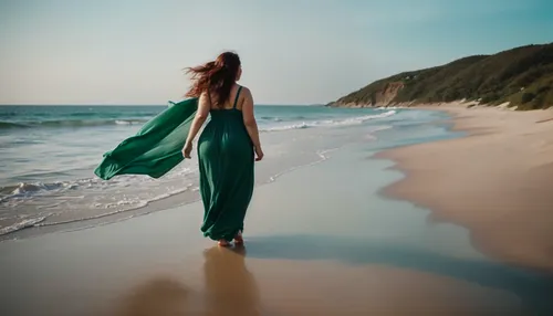 woman in green dress walking along the beach,girl on the dune,eurythmy,girl in a long dress,walk on the beach,girl walking away,girl in a long dress from the back,beach background,woman walking,emeral