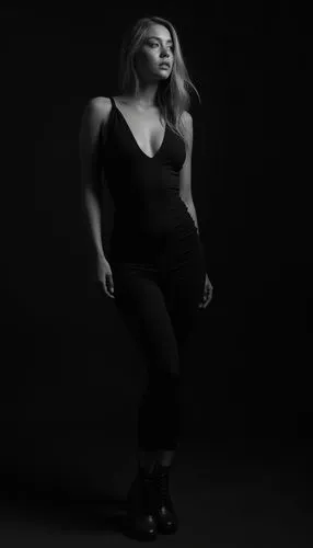 strongwoman,black background,studio light,photo session in bodysuit,studio photo,woman silhouette