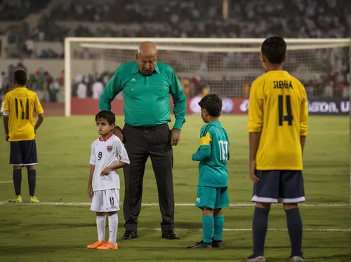 referee,the referee,tall man,height,father and son,father-son,dad and son,goalkeeper,blessing of children,standing man,abdel rahman,referees,cracks,penalty card,tallest,big hero,next generation,fathers and sons,captain,three kings,Photography,Documentary Photography,Documentary Photography 13