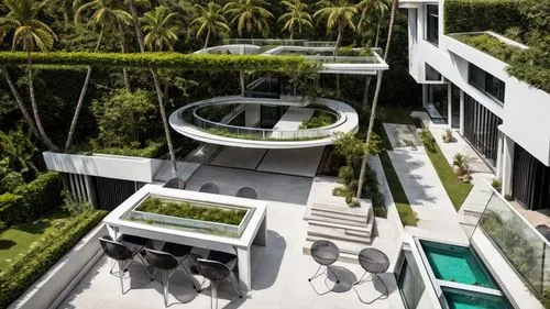 Kitchen from a luxurious and modern villa. House with white walls. Large windows with black metal profiles. White furniture... Golden tape and sink... white marble floor... garden of grass, natural sw