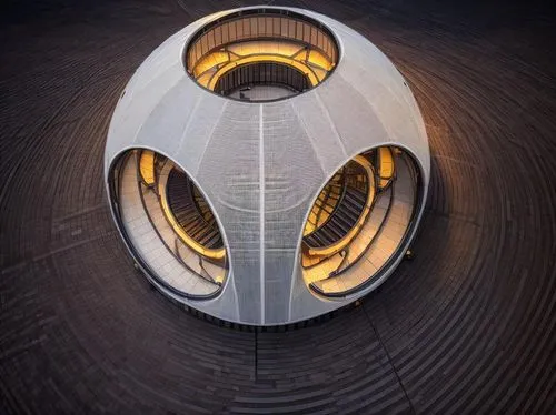 a drone landing center building at night,futuristic architecture,heatherwick,blavatnik,autostadt wolfsburg,pilgrim shell,futuristic art museum,morphosis,toroid,helix,eliasson,ducted,mercedes-benz muse