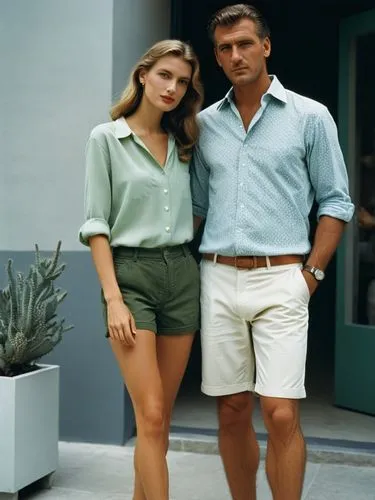 Create an elegant hand-holding couple in shorts that will show off your best work.,a man and woman posing for a picture,banacek,model years 1960-63,vintage man and woman,model years 1958 to 1967,hagma