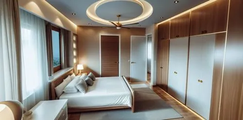 Bedroom with modern interior, decorative modern false ceiling, 4 door wardrobes opposite bed, wall art with lights and the door facing the camera leading into the bathroom and another next to the ward