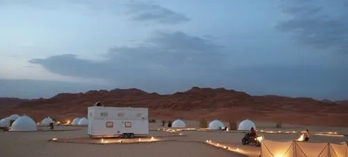 saudi arabia desert background,a small white tent that is set up in the middle of nowhere,wadirum,timna park,wadi rum,nuweiba,flaming mountains,amanresorts