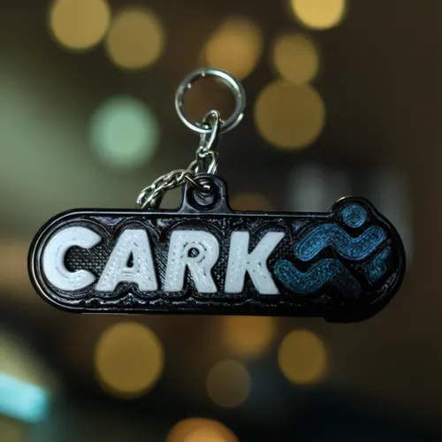 keychain with the image, on a table,car keys,car key,carabiner,key ring,keyring,keychain,car badge,corkscrew,carakara,cork,door key,parked car,house keys,clerk,car,house key,corks,carrack,farbkleks,ar