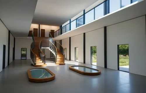 interior de escuela  con volumen geometrico de alto relieve, con dos jardineras, puertas modernas, con personas estudiantil,circular staircase,interior modern design,hallway space,winding staircase,ou