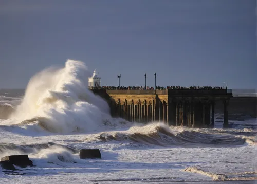 Rough seas are buffeted against Tynemouth Pier as the sun rises in Tynemouth, England, Sunday, Oct. 28, 2018.,breakwater,breakwaters,the old breakwater,cromer pier,storm surge,coastal protection,crome