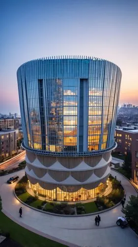 A magnificent building towering above the bustling streets of an urban neighborhood. This architectural marvel features sleek, modern lines and a facade adorned with expansive glass panels that reflec