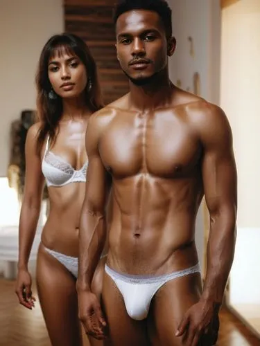 The sceneThe picture shows a man and a woman in a modern, well-lit interior. Both are wearing white underwear. The man stands in the foreground, is muscular and wears tight-fitting white underwear. Th