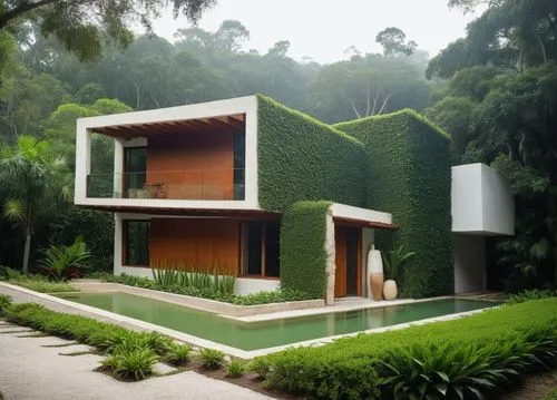 a house covered in lush green leaves next to a pond,cube house,cubic house,forest house,tropical house,green living,landscaped,Photography,General,Realistic