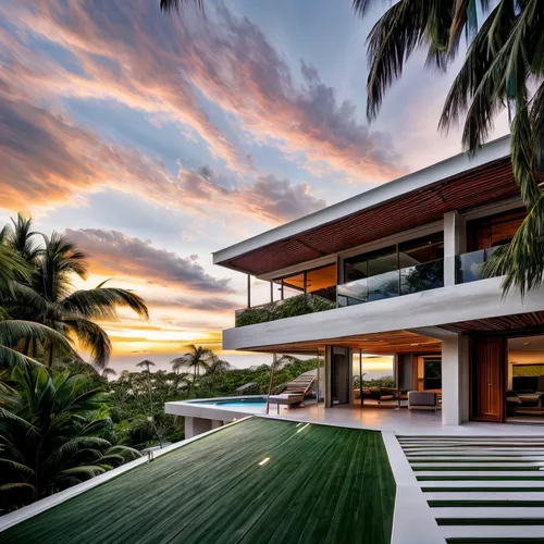 image of a contemporary cantilever roof single-family townhouse located in the Caribbean, featuring a white concrete structure with wood accents, surrounded by a lush tropical landscape during sunset.