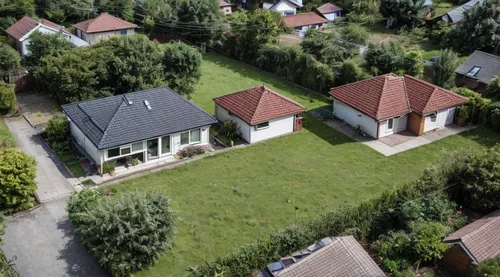 Insert a small ground floor house, a bungalow with a flat roof, in the left part of the photo.
,uckermark,private estate,escher village,chalets,drone image,houses,small münsterländer,exzenterhaus,row 