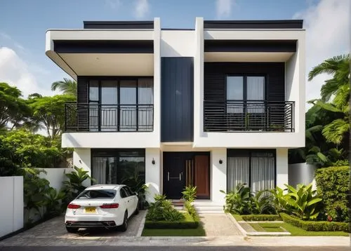 Duplex house, modern Nigerian architecture, 2-story building, rectangular shape, flat roof, white walls, large windows, sliding glass doors, balconies with black railings, ornate gates, lush greenery 