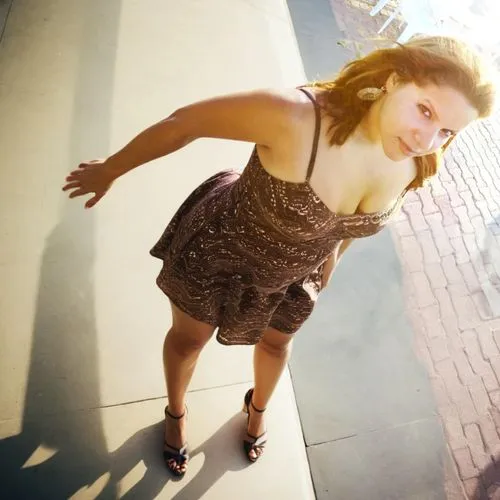 woman standing, thick thighs, seen from above, high angle photography, short summer dress,girl on the stairs,female model,portrait photography,a girl in a dress,senior photos,on the roof,plus-size mod