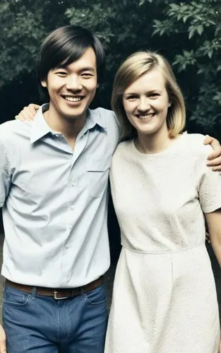 a man and a woman standing next to each other smiling,kpcb,marick,miyamoto,colorization,koevermans,anniversary 50 years