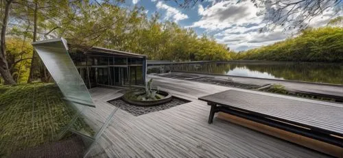 wooden decking,landscape designers sydney,wooden bridge,landscape design sydney,wood deck,decking,grass roof,inverted cottage,stilt house,summer house,boat house,boathouse,teak bridge,boat dock,eco ho