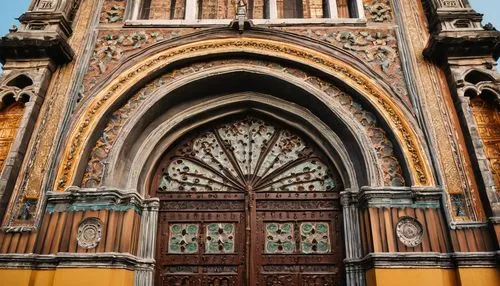 Baroque-style, ornate, grand, historic, Philippine church, intricately carved wooden doors, stained glass windows, vibrant colored tiles, Gothic arches, ribbed vaults, imposing bell towers, intricate 