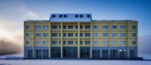 A modern residential building in Magadan, a fabric is used as the facade, which is fixed on a light metal frame. The bulging part of the building is made of glass. There should be soft lighting in the