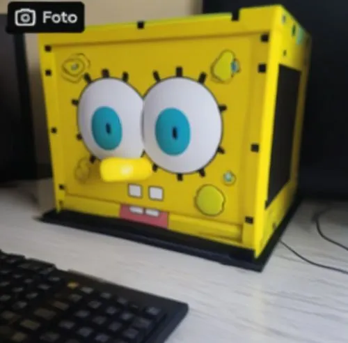 yellow toy with two blue eyes on top of a computer keyboard,packbot,fertik,petito,petsamo,pixaba,squarepants