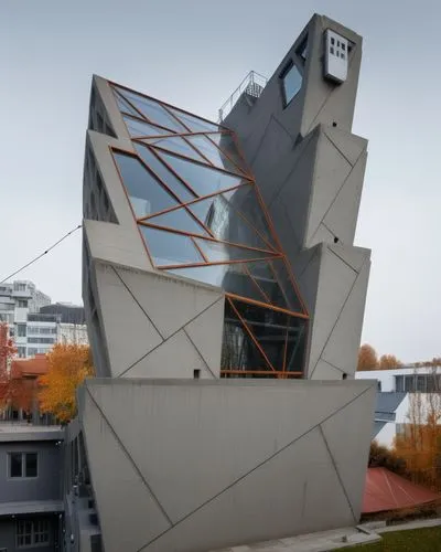 there is an interesting building that has metal structures on it,morphosis,snohetta,futuroscope,vitra,cubic house,hejduk