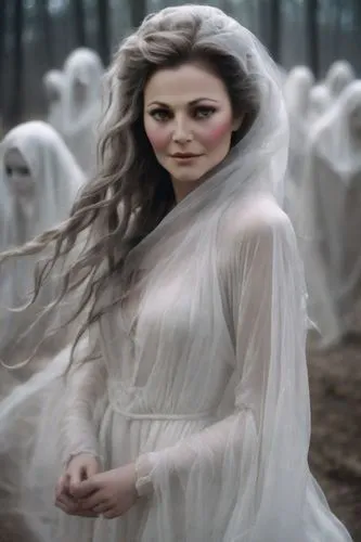 a woman dressed in a white wedding gown stands among ghosts,dead bride,white rose snow queen,the bride,ghostley,covens,havisham,melian,volturi,llorona,tvd,elenore,the snow queen,galadriel,wedding dres