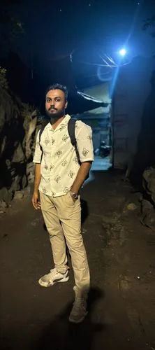 the man standing with a backpack is very in need of work,cave tour,mutahi,mutairi,mutapa,kafeel,shrivastav,mutawakil,subbaraman,spelunker,mutasim,gaikwad,spelunking,dbd,amarnath,pathmanathan,garhbeta,