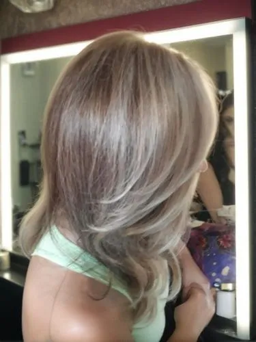 she is in a beauty salon,caramel color,hair coloring,natural color,asymmetric cut,silvery,trend color,smooth hair,layered hair,champagne color,lace wig,short blond hair,blonde,blond hair,hair shear,gr