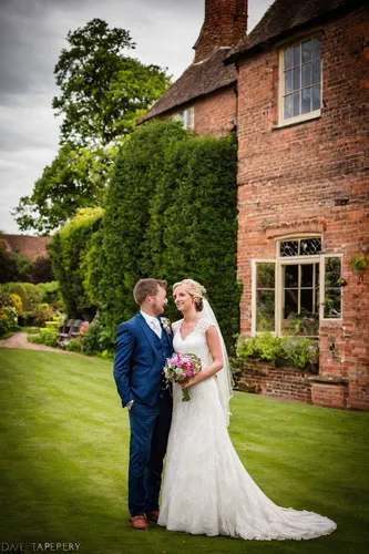 wedding photography,elizabethan manor house,wedding photographer,great chalfield,thatched cottage,bride and groom,thatched roof,wedding couple,portrait photographers,blonde in wedding dress,wedding photo,wedding frame,silver wedding,thatch roof,wedding flowers,wedding details,wedding dresses,grooms,timber framed building,thatch roofed hose,Photography,Documentary Photography,Documentary Photography 10