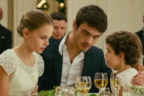 Create a furious dialogue between two siblings at a crowded family dinner.,dizi,two meters,grand hotel,elvan,the stake,doll's house,godfather,rose family,flightless bird,the girl's face,wedding banque