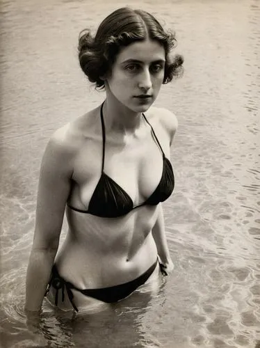 a woman in a bikini walking through shallow water,the woman is wearing a black bikini in the water,lartigue,isadora,myrna,meyerhold,vintage female portrait,inez koebner,Photography,Black and white pho