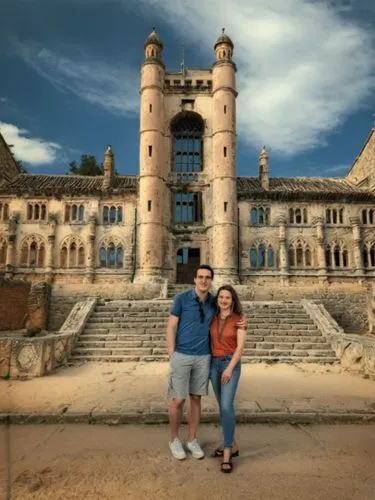 man and woman posing in front of an ancient building,two people pose in front of an old castle,bussaco,izamal,iisc,port arthur,chittorgarh,champaner,Photography,Black and white photography,Black and W